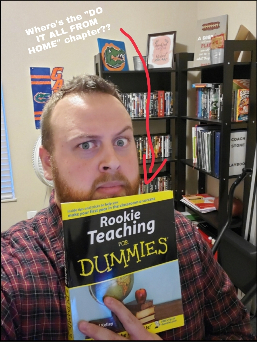 teacher holding a book with an arrow
